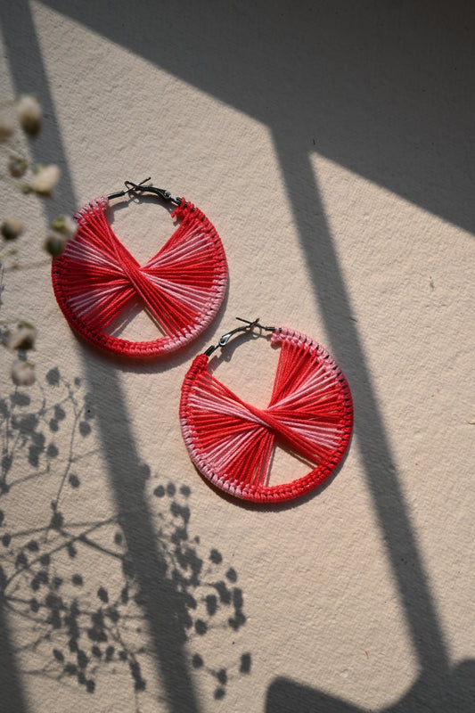 Red tinted criss cross crochet earrings